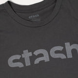 Close up view of logo and neck tag on grey Stash Watermark t-shirt